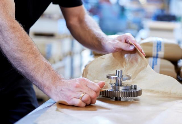 man with gear in production